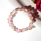 Close-up image of transparent crystal beads on dual-tone stretch bracelet