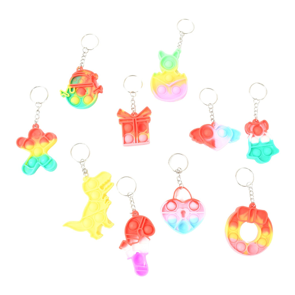 A Pop It Keychain attached to a backpack, demonstrating its portability as a fidget toy.