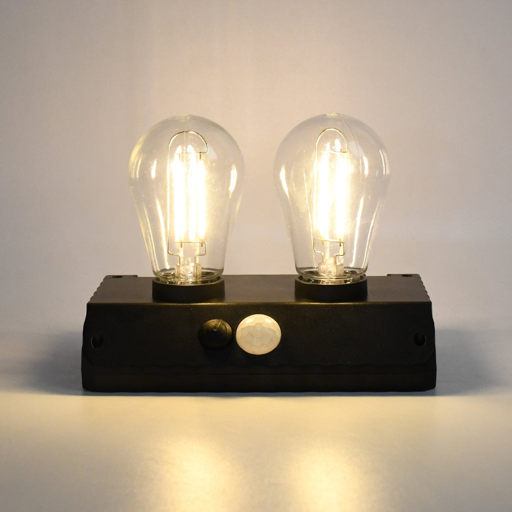 Indo Glow Solar Double LED Lamp providing ample light for an outdoor area.