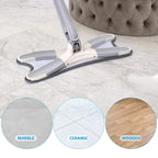 The adjustable Flat Mop handle extended for cleaning a high window or wall.