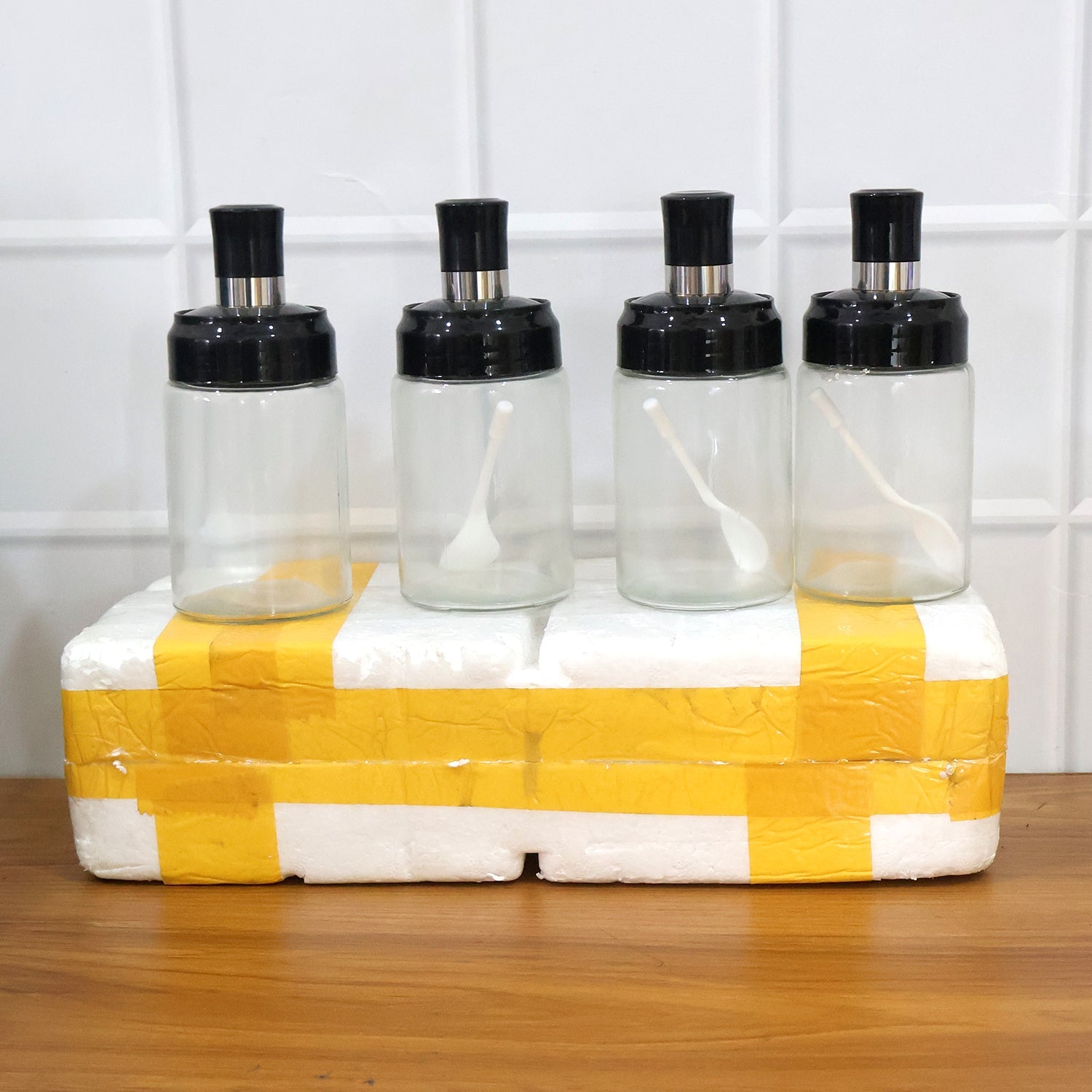 Reusable transparent spice jars with airtight lids and practical spoon inside