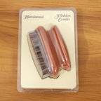Back view of manual scalp massage brush with flexible bristles for shampoo