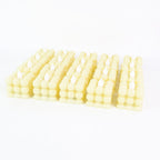 Decorative table setting illuminated by warm LED flameless cube candles