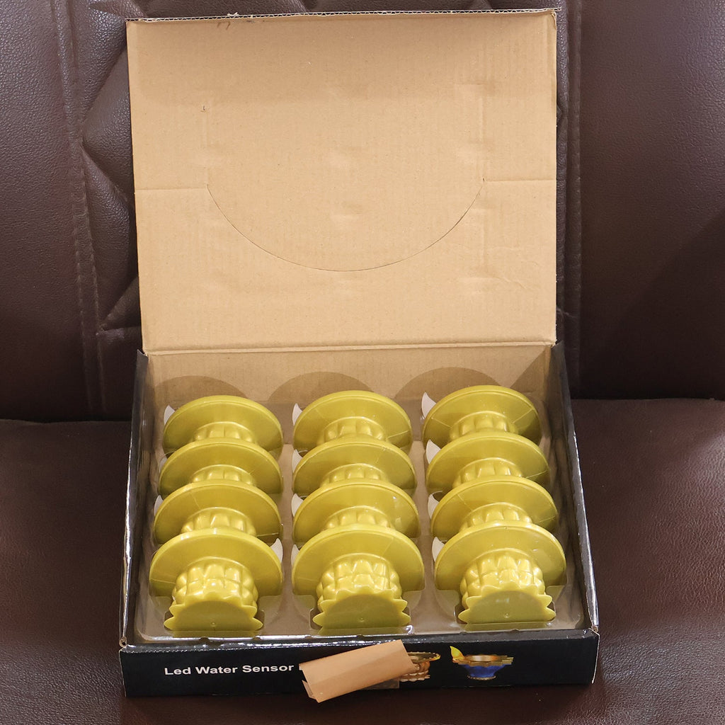 Set of flameless water sensor golden LED diyas for spiritual and home decor use