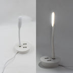 Compact Portable USB Fan and light connected to a power source.