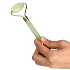 Daily facial massage using dual head face roller tool