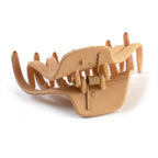 Side profile of matte plastic hair clamp showing lightweight structure