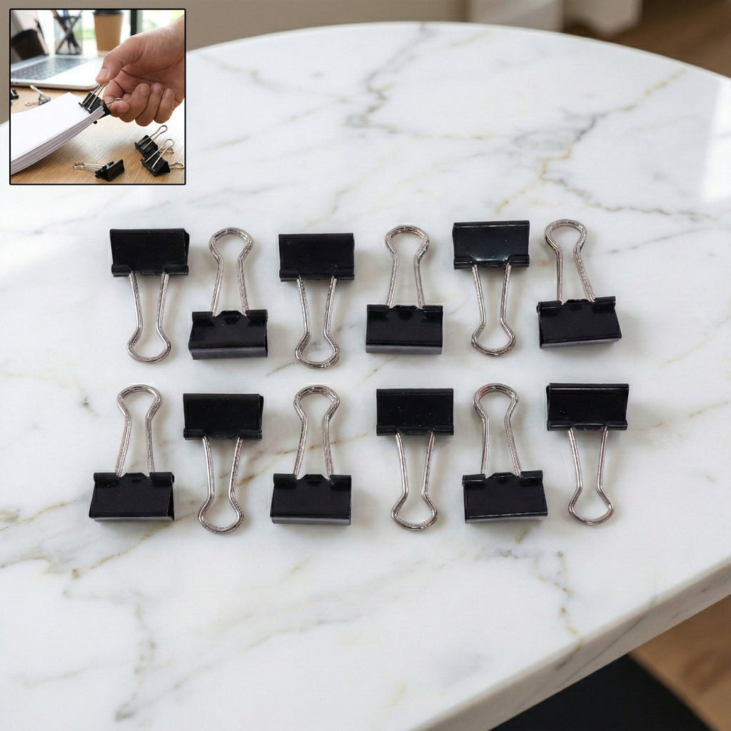 Pile of black metal binder clips 19mm size together