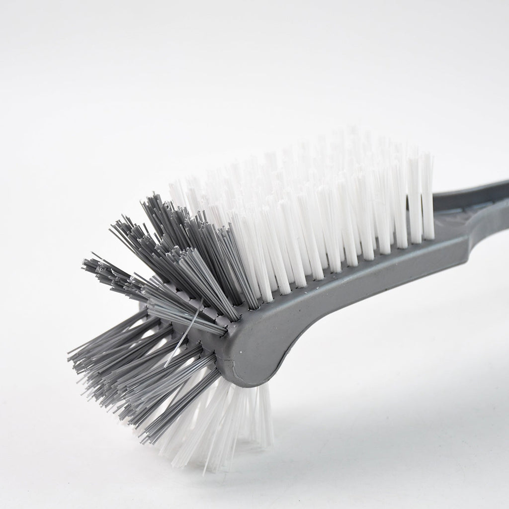 Long handle toilet cleaning brush shown angled for under-rim reach