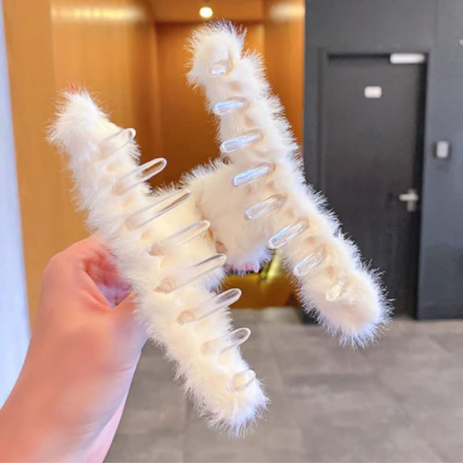 Plush hair claw clip securing a full head of hair, showing its strong yet gentle grip.