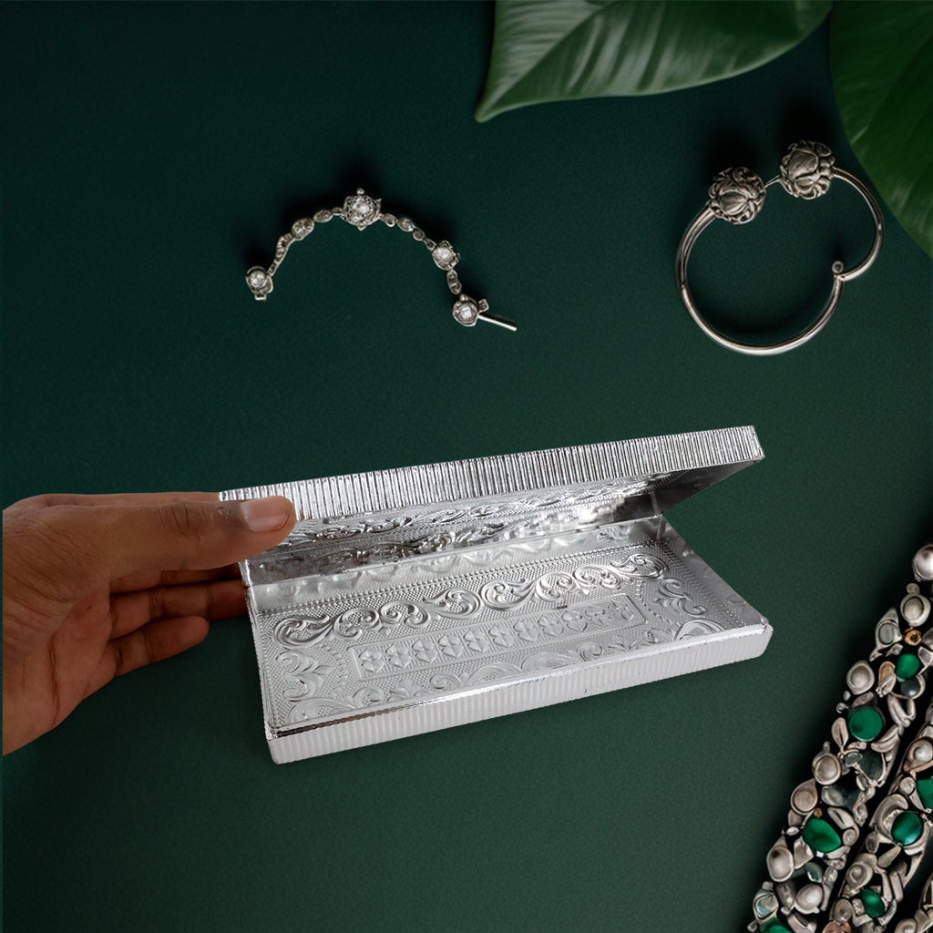 Interior view of decorative silver multipurpose cash box showing storage space