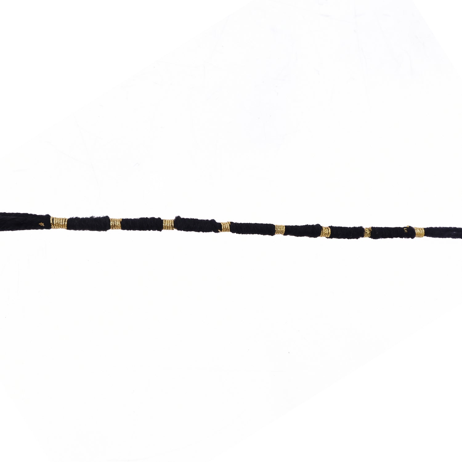 Red Mauli rakhi with gold and pearl details for festival