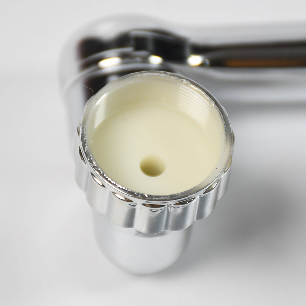Movable tap water saving filter shown extended, perfect for reaching all areas of the sink.