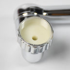 Movable tap water saving filter shown extended, perfect for reaching all areas of the sink.