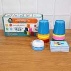 Stacking cups and bell arranged for an exciting kids' game