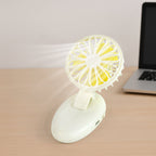 Mini USB fan with its handle extended, ready for handheld use.