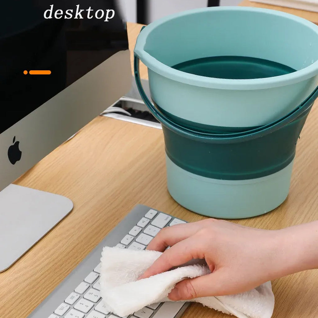 The foldable water bucket with its sturdy handle, ready for carrying.