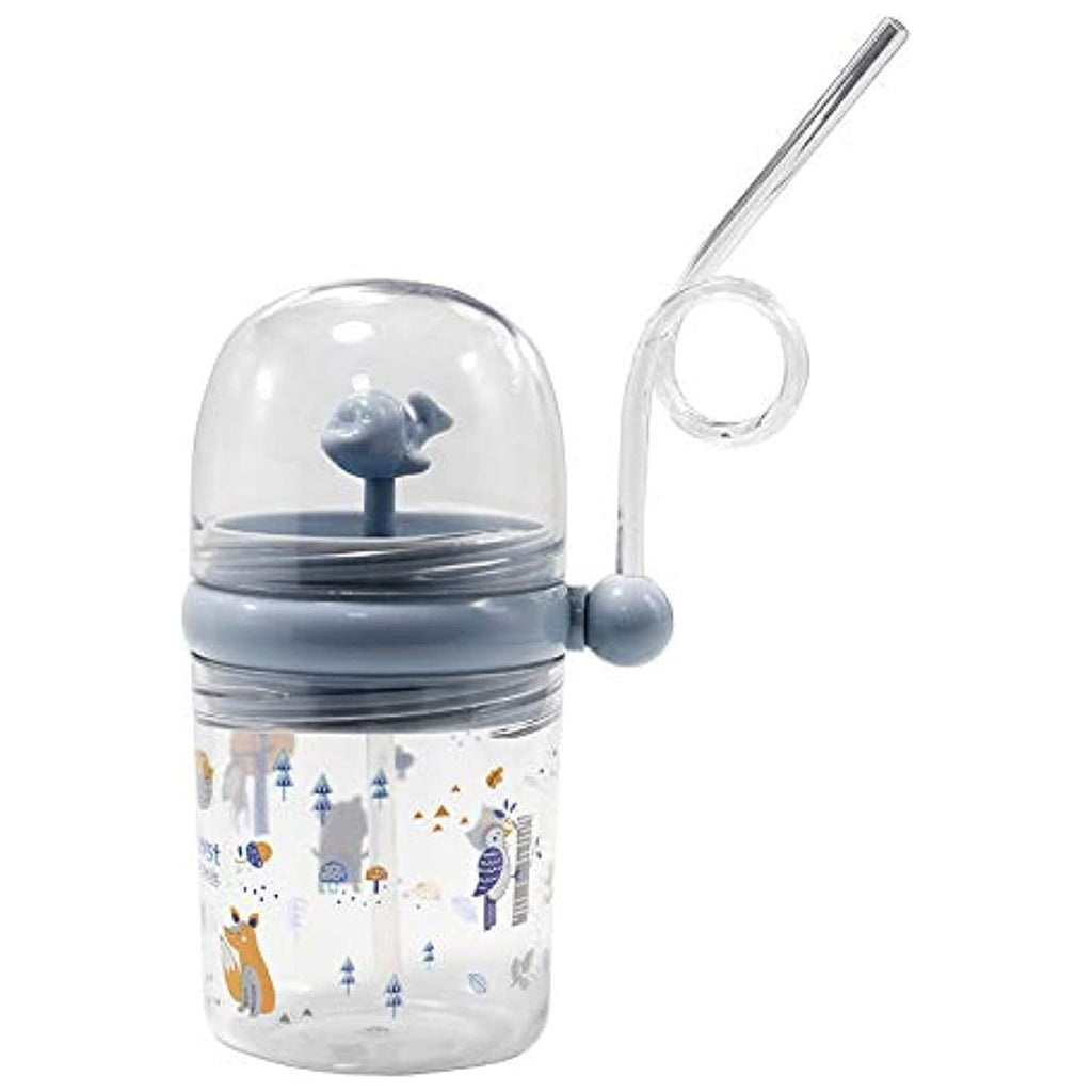 Toddler playing with the Whale Spray Sippy Cup, showing the fun water spray feature in action.