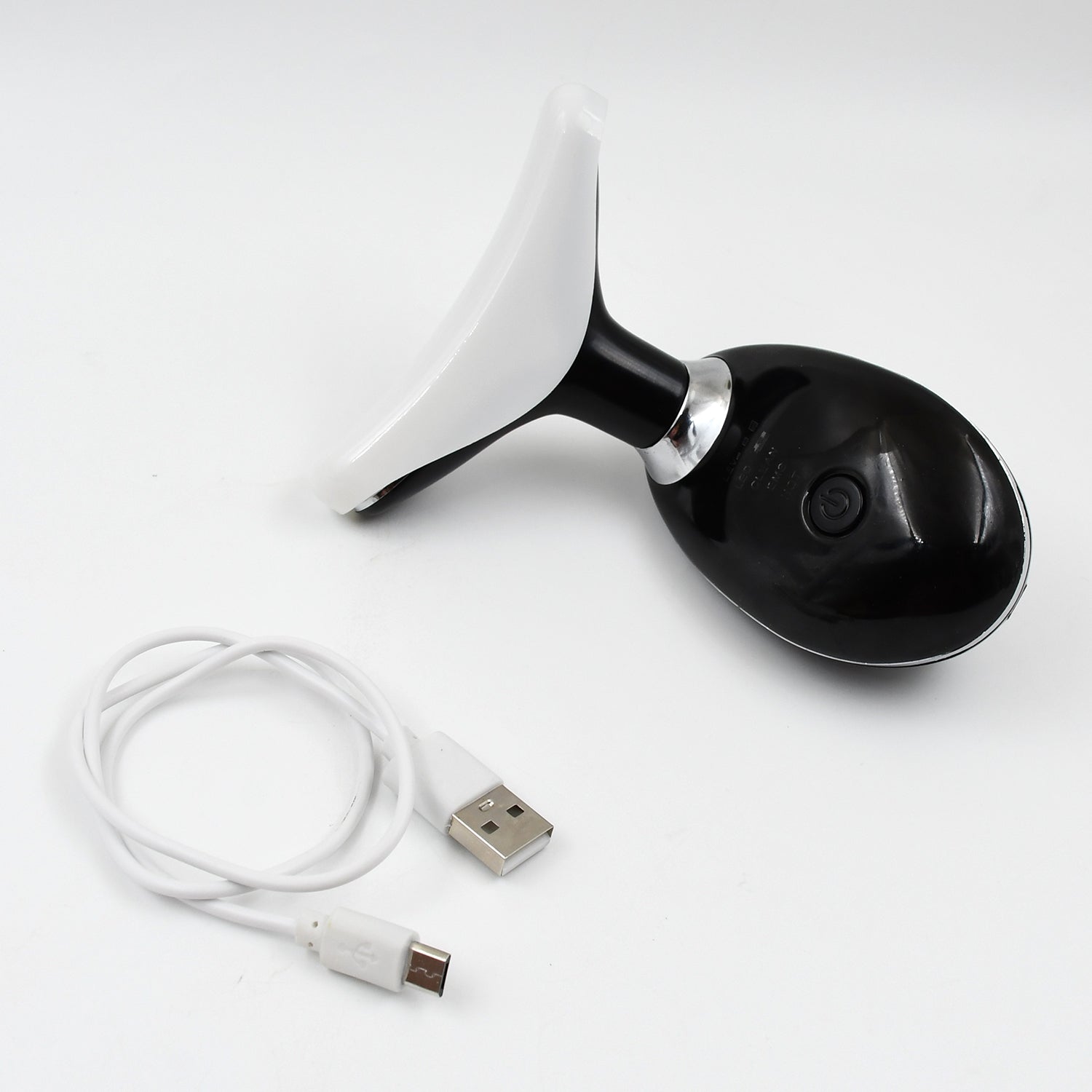 The portable Neck Face Massager shown with its USB charging cable.