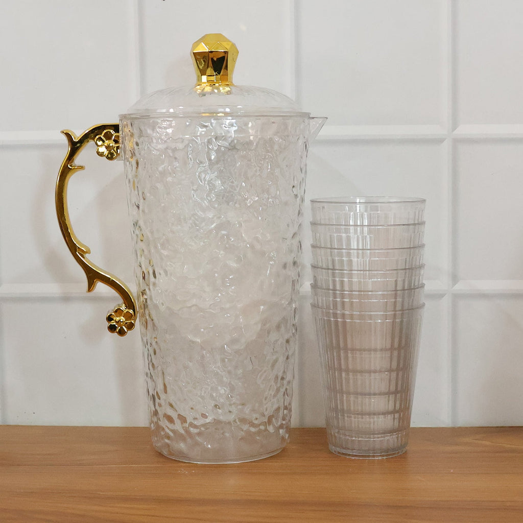 Matching tumblers complementing the textured glass water jug set