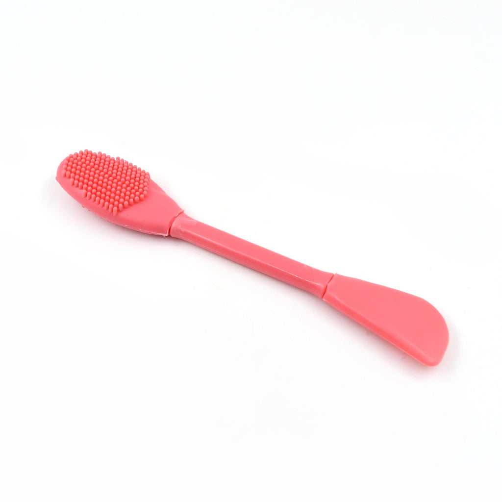 Ergonomic silicone face mask applicator for comfortable and controlled skincare application.