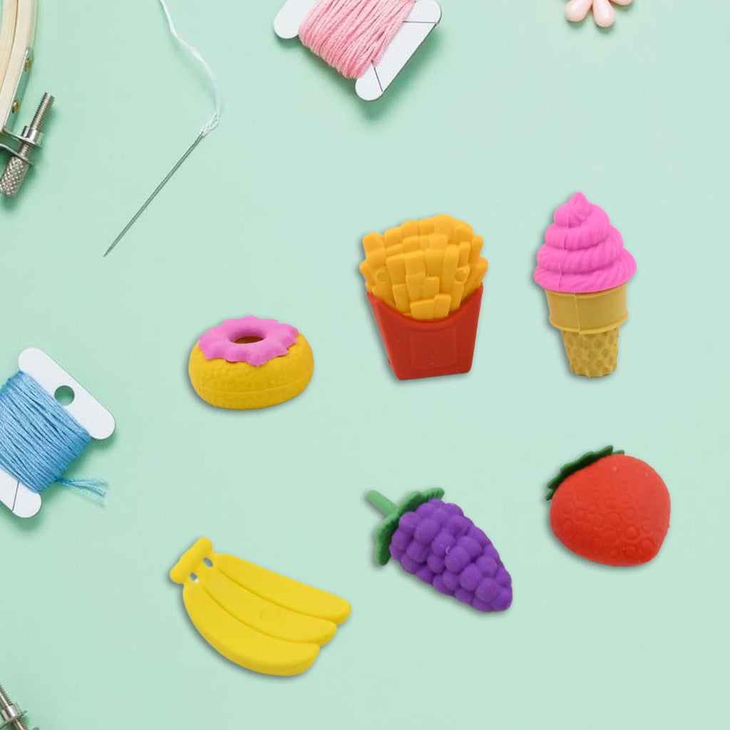 Detailed view of bright 3D cupcake and ice cream novelty erasers.
