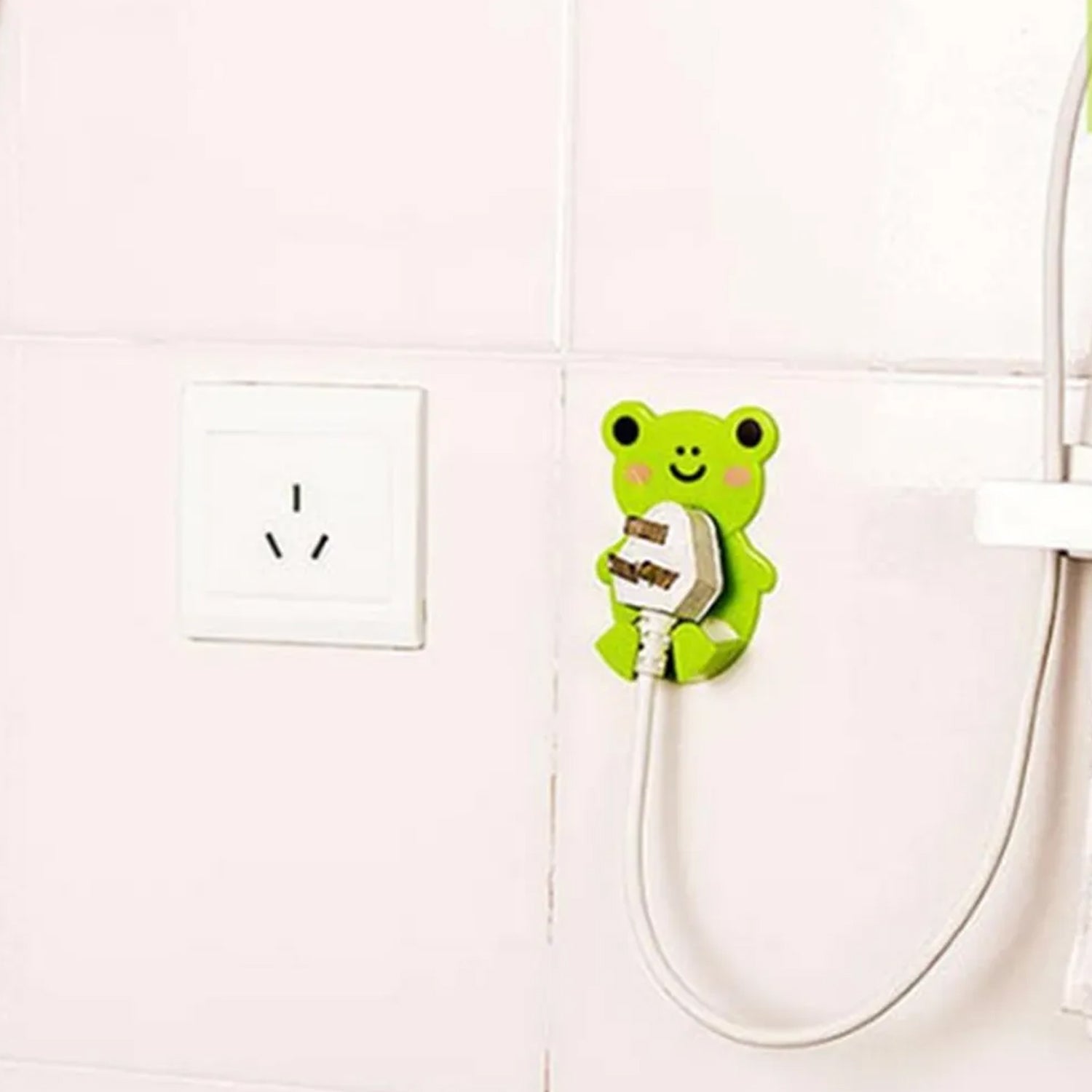 Adhesive socket holder with plugs hung detail