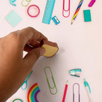 Toast bread erasers displayed with other school supplies on a colorful background.