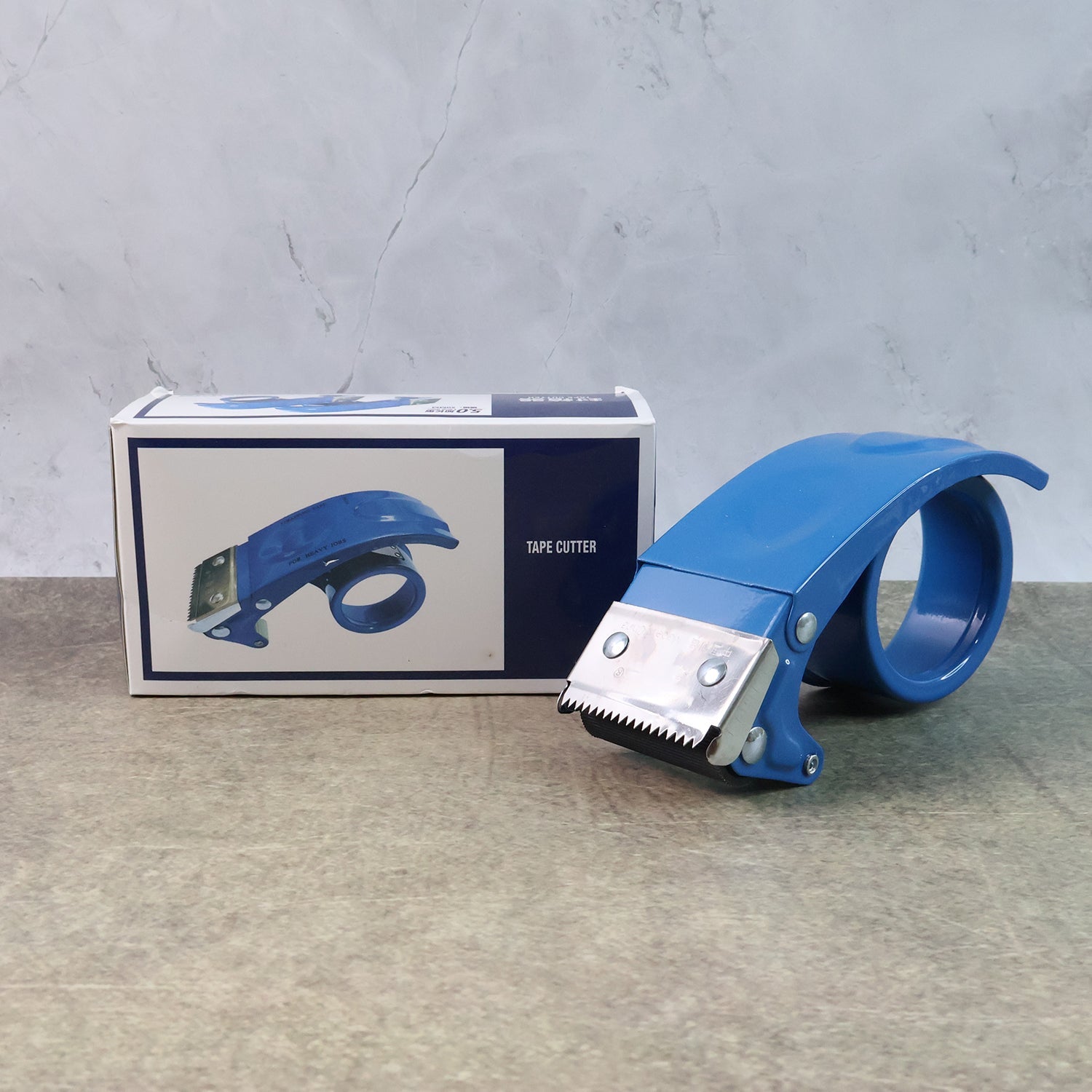Packing tape dispenser for fast carton sealing with sharp blade