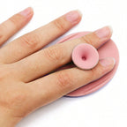 Clean silicone facial cleansing brush after use, showing its hygienic design.