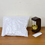Side view of wooden stand and brass chime ball Japanese Style Zen Bell