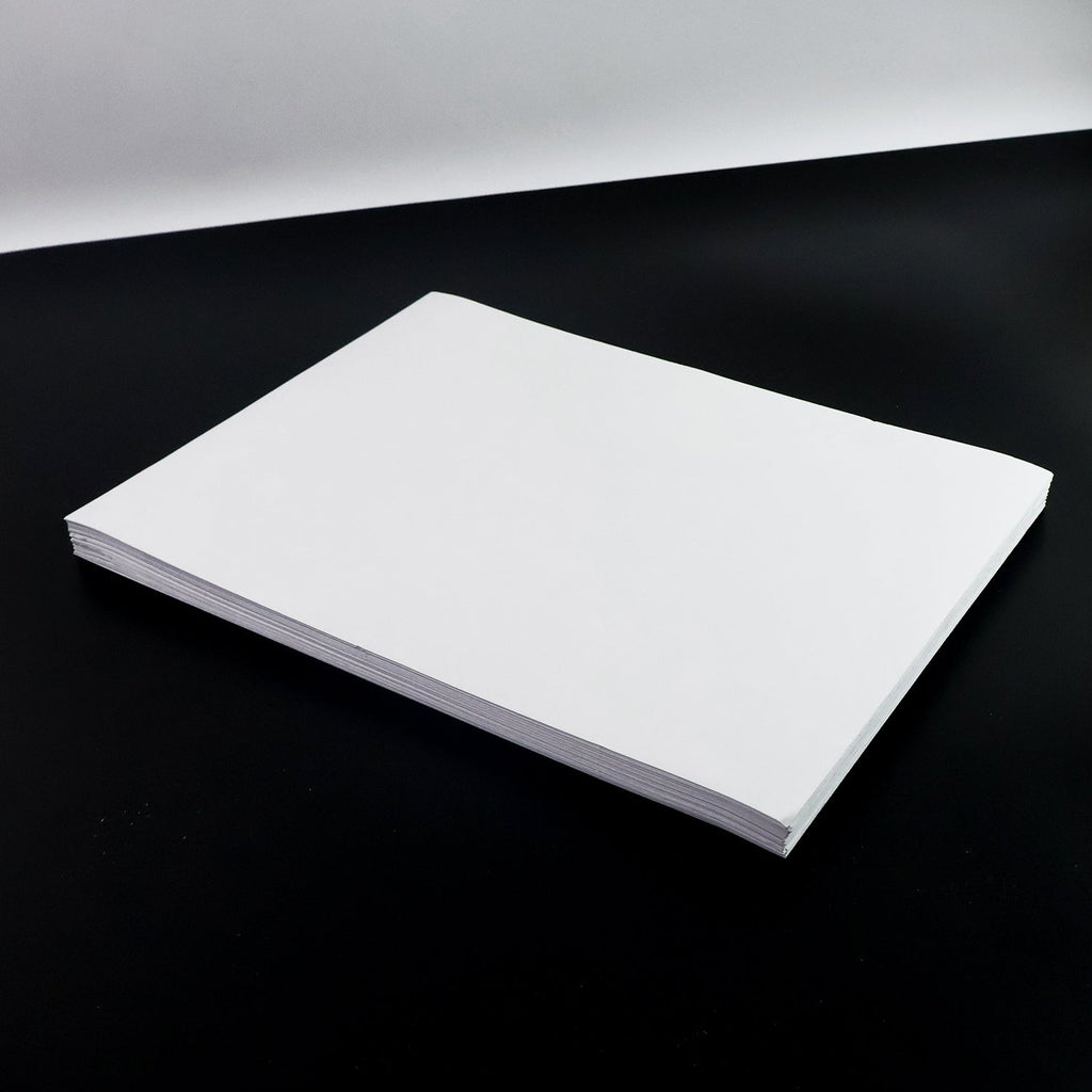 White A4 self-adhesive label sheets stacked neatly for printing