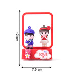 Soft LED light from couple figurine enhancing home decor ambiance