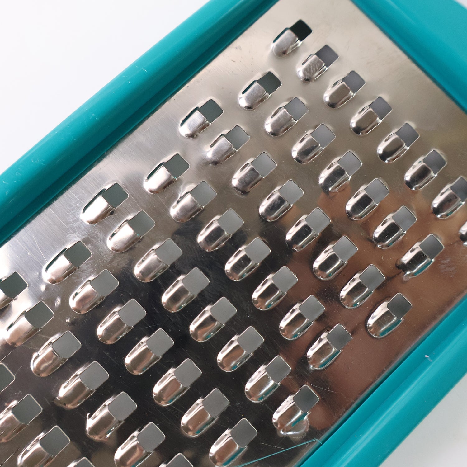 Supermom handheld cheese and vegetable grater with durable plastic frame