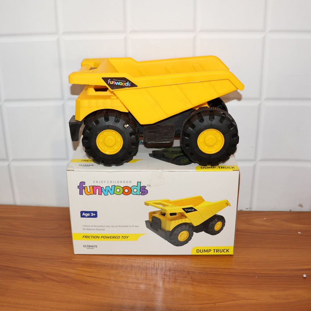 Side view of friction-powered dump truck toy with easy-roll big wheels