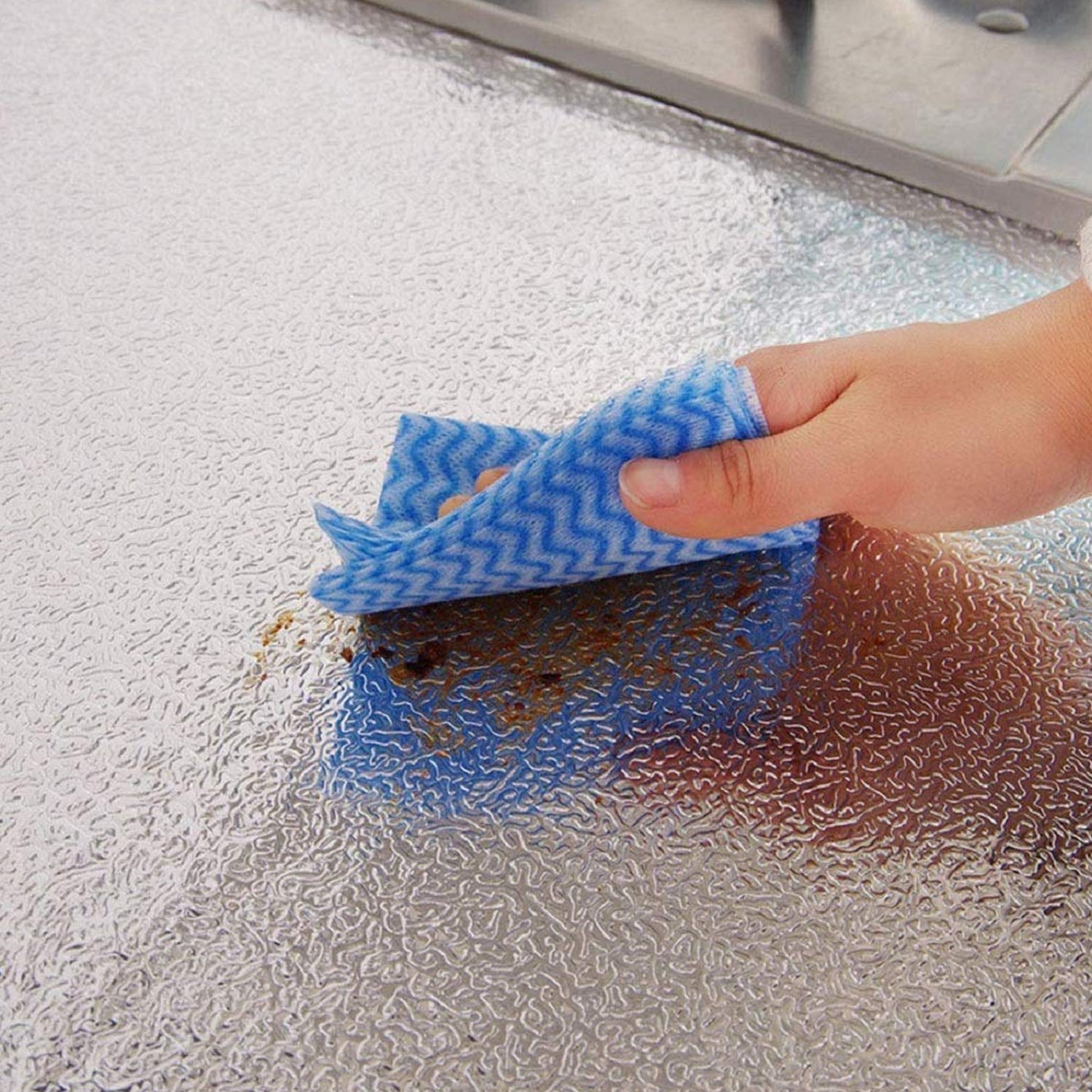 Modern kitchen backsplash featuring easy-to-clean aluminum foil wallpaper.