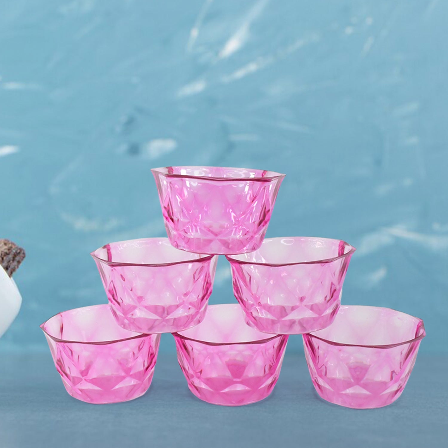 Group of 6 plastic bowls, highlighting their diamond cut design.