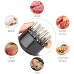 Detailed view of the meat tenderizer tool's spring mechanism and needle array.