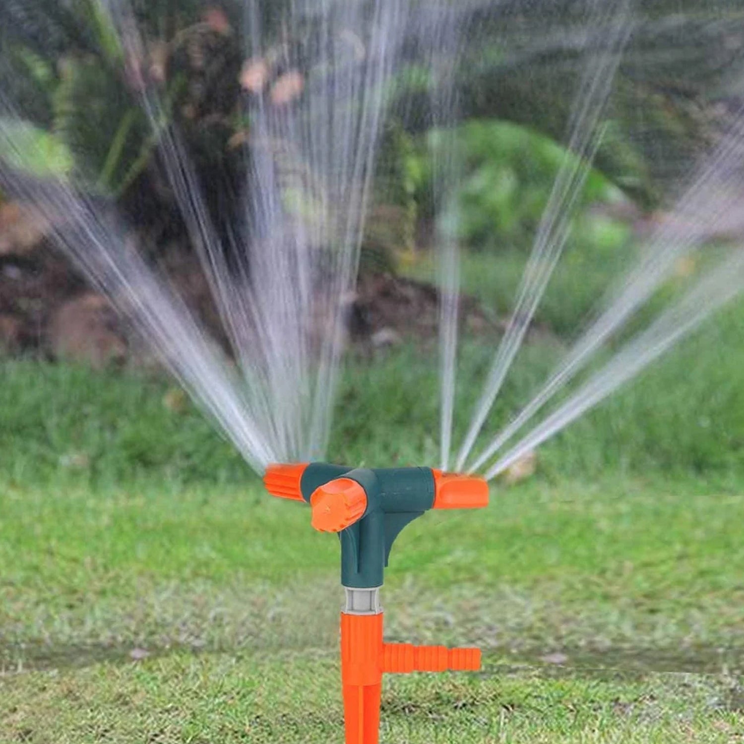 Close-up of the adjustable nozzles on the rotating garden sprinkler.