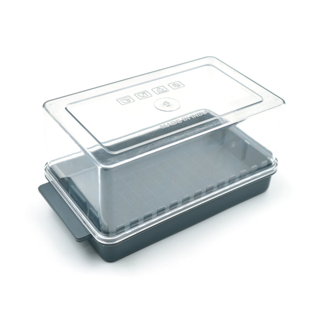Elegant transparent butter storage box displayed on a kitchen table, highlighting its sleek design.