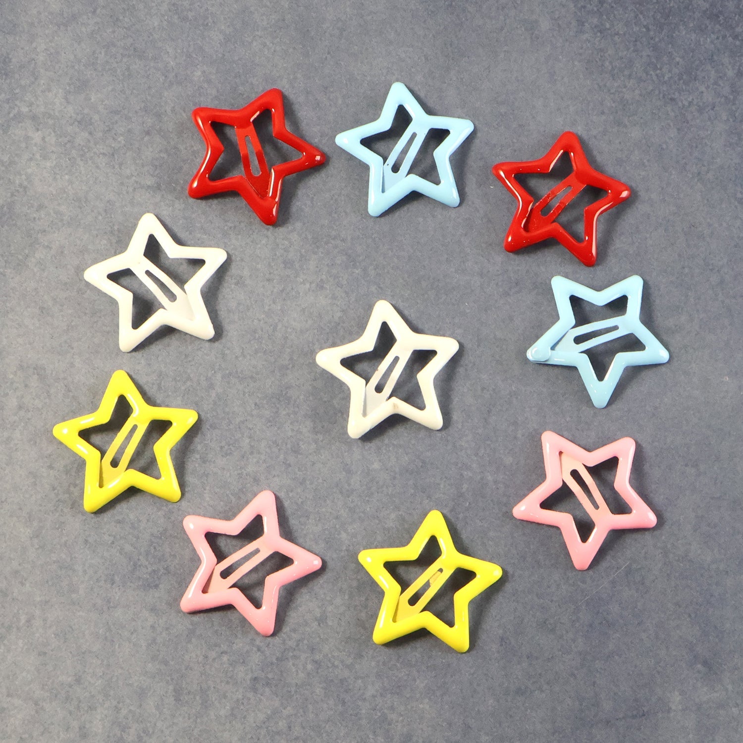 Close-up image of star-shaped metal hair clips showing detail