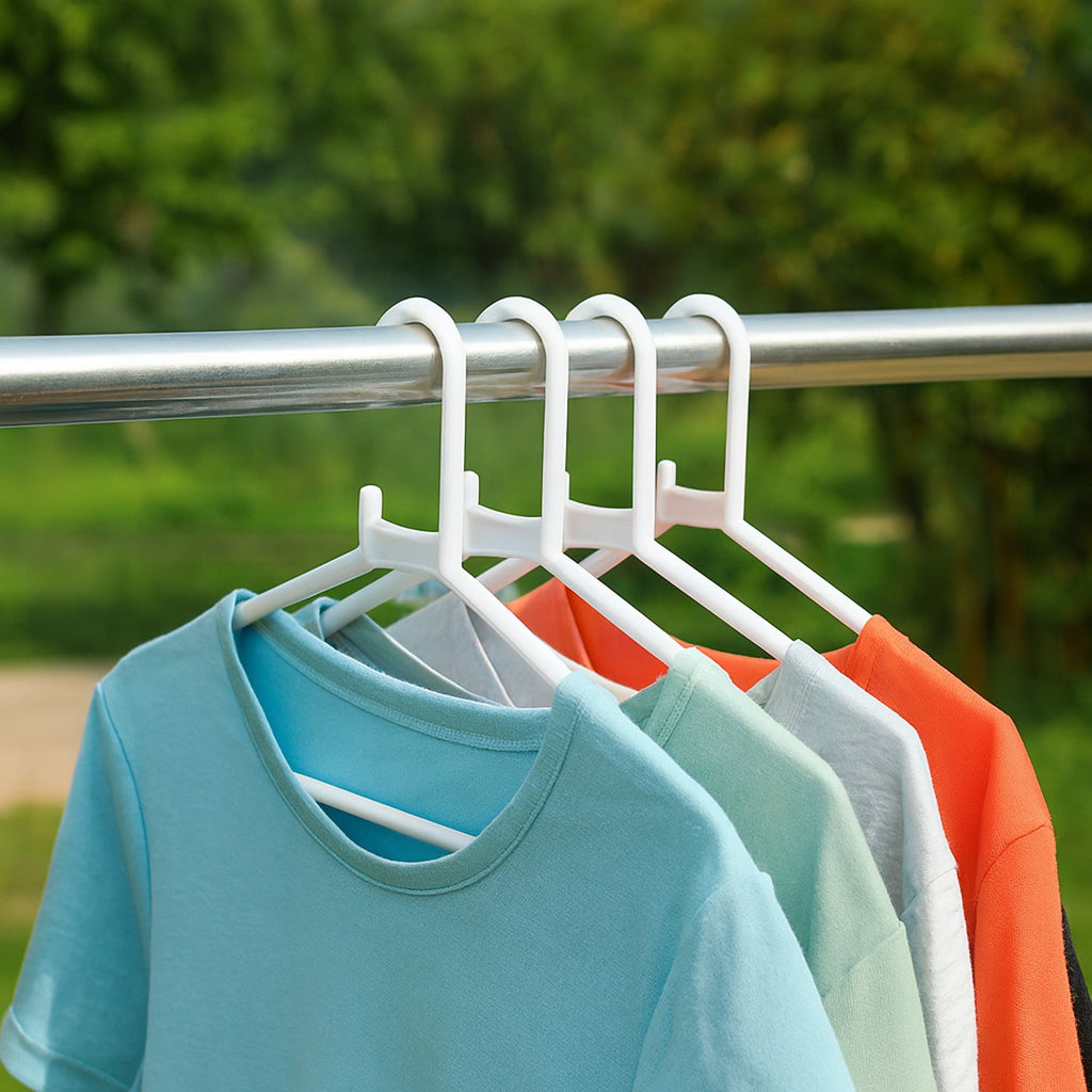 Close-up view of a single durable white plastic clothes hanger