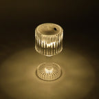 Night ambience created by warm light of LED crystal-effect table lamps