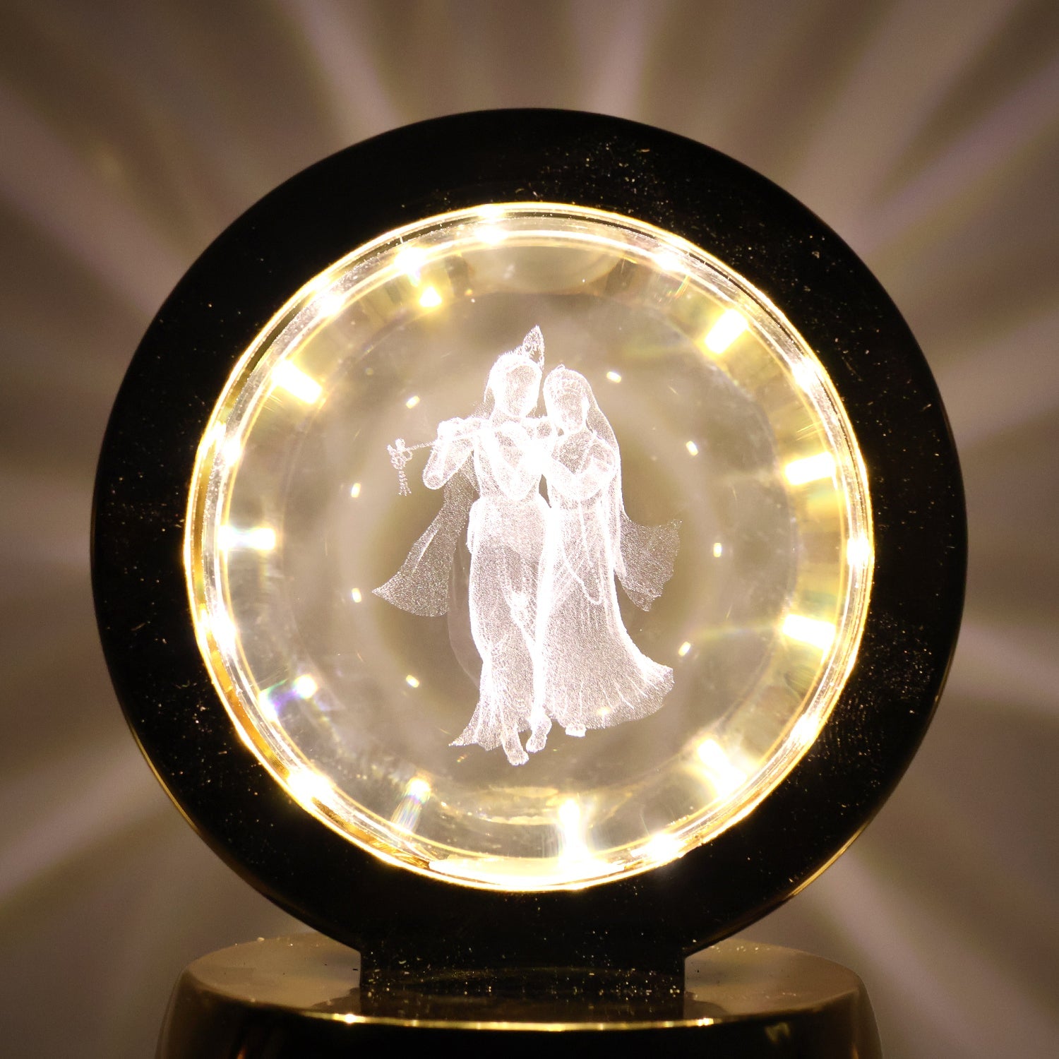 Golden base Radhe Krishna decorative lamp emitting soft ambient LED light