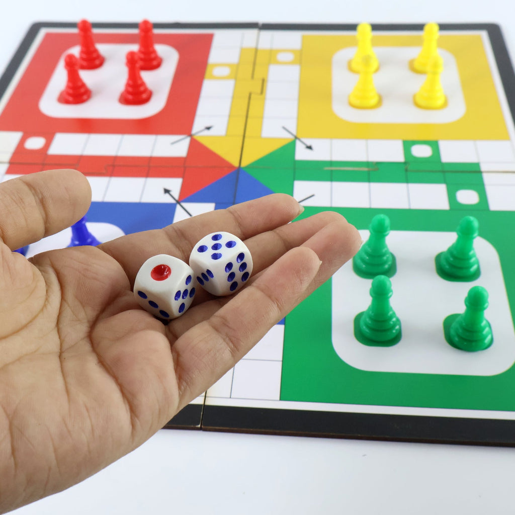 Children playing the portable Ludo board game together, enjoying family fun.