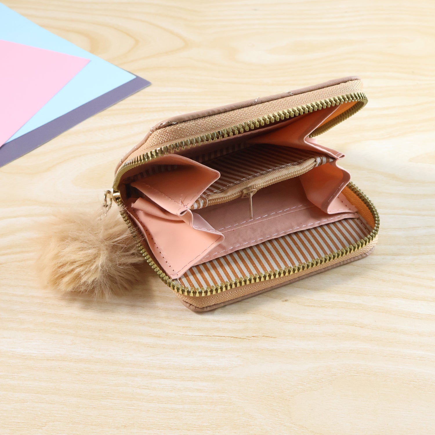 Secure zip-around children’s wallet featuring a soft fur zip puller