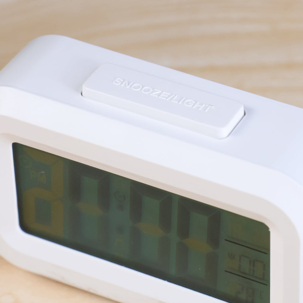 Mini digital alarm clock front view with easy controls