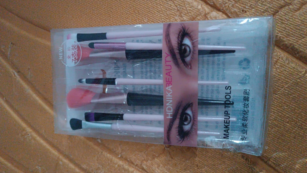 Compact travel-friendly soft makeup brush set inside pouch ready for use