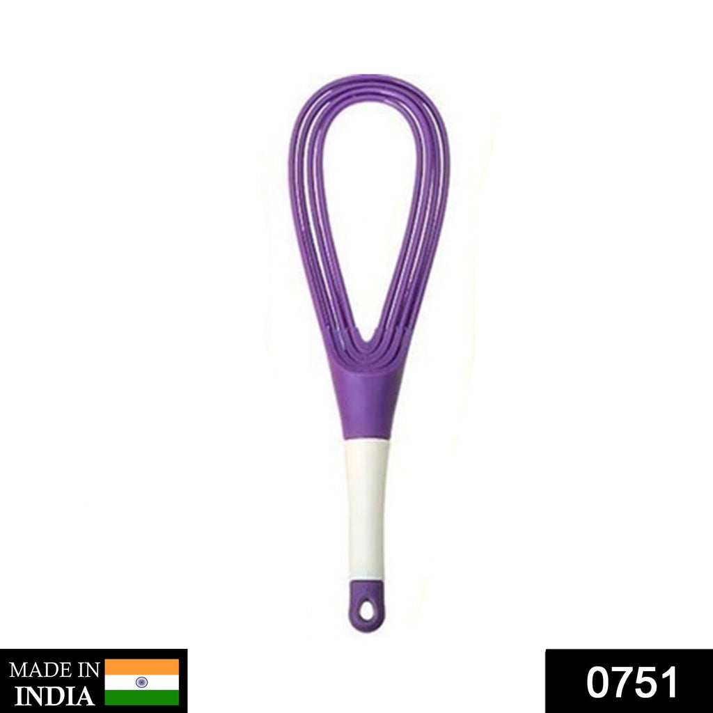 Plastic whisk mixer effortlessly blending milk and coffee for a smooth drink.