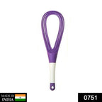 Plastic whisk mixer effortlessly blending milk and coffee for a smooth drink.